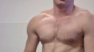 Muscular fitness guy is jerking off in laziness